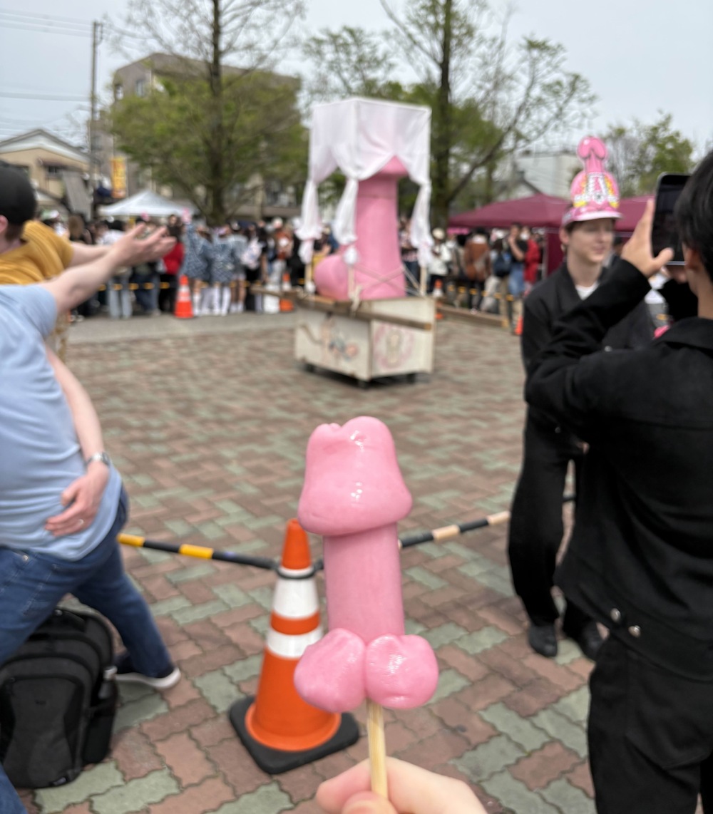 Penis candy with large penis behind it