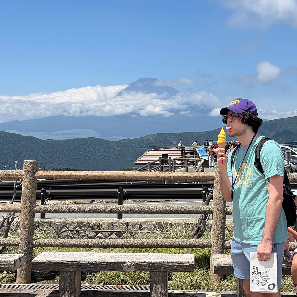 licking egg ice cream in front of mt fuji