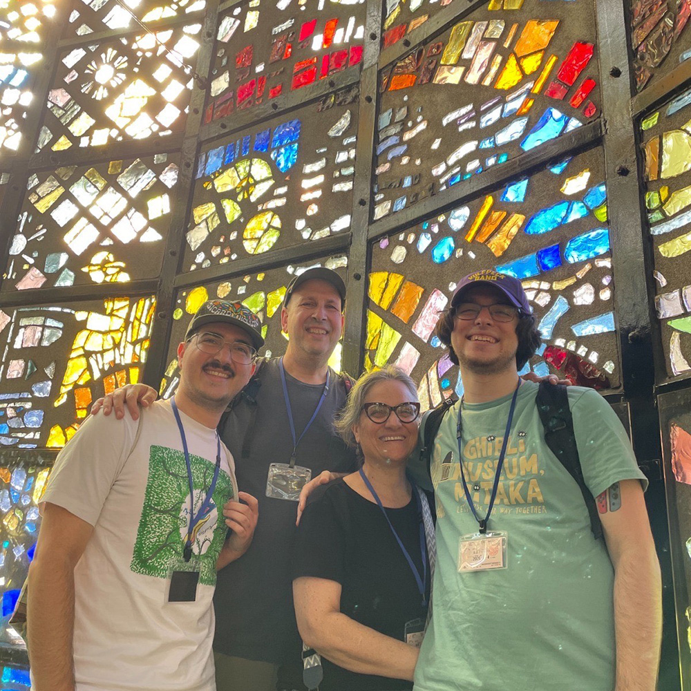 family in stained glass tower